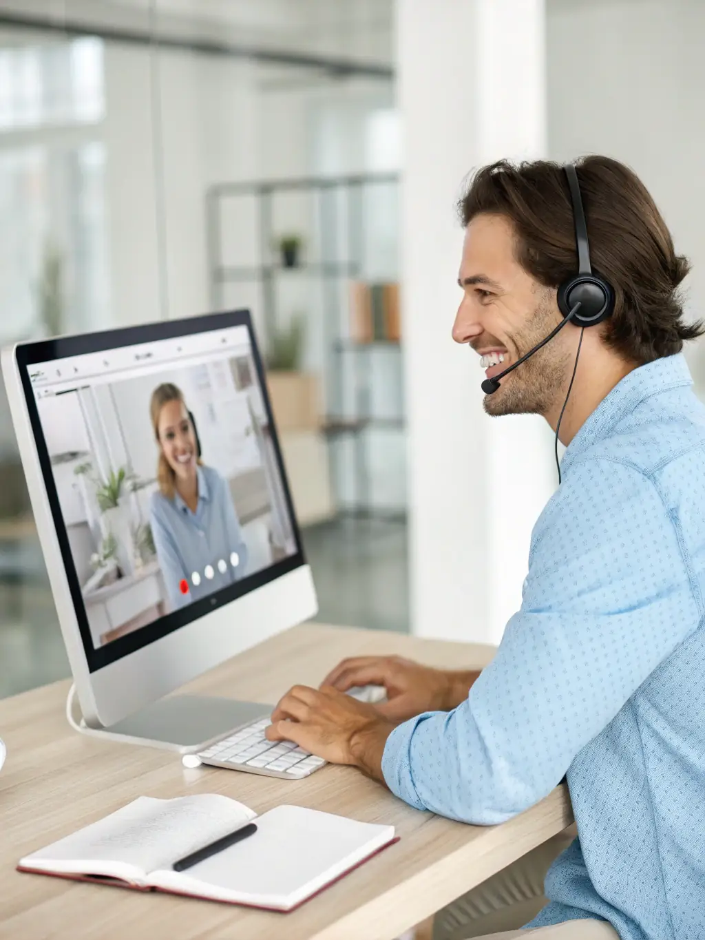 A support technician remotely assisting a doctor with an Epic EHR issue on a computer screen in a hospital setting.